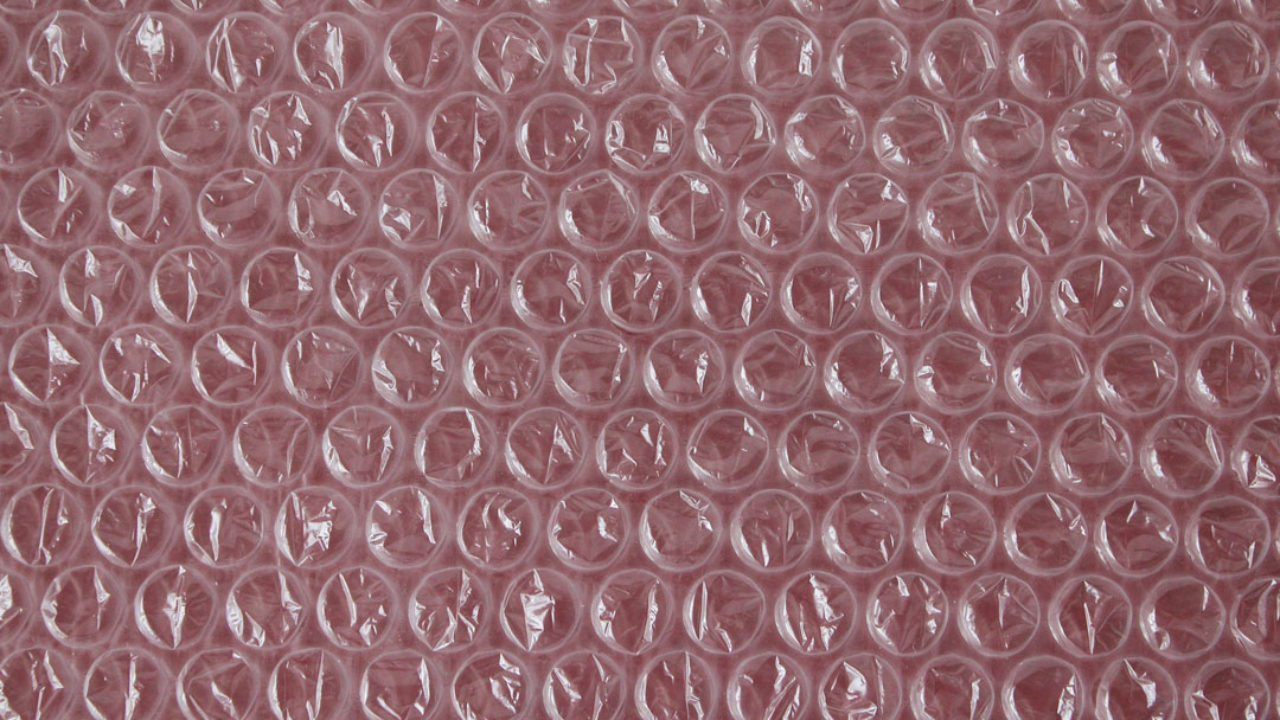 Premium Photo  Packaging with air bubbles on a pink background. bubble  wrap texture, packaging, air bubble film. top view. copy, empty space for  text